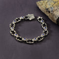 Pulsera de cadena con piedras preciosas de zafiro grabadas en plata