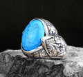 Silberner handgefertigter Ring mit graviertem Türkisstein
